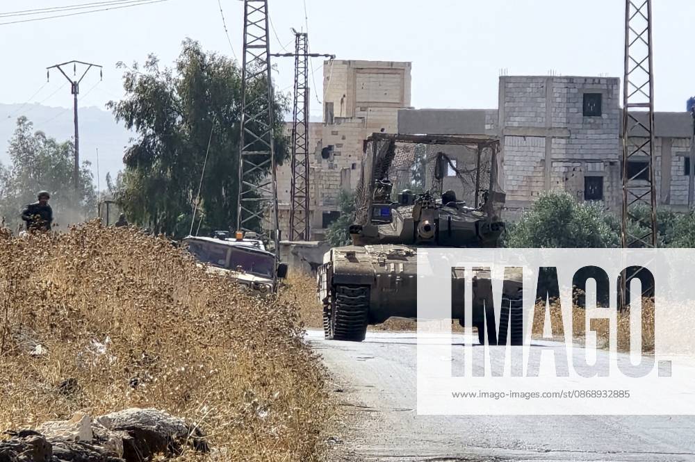 Israeli army conducts raids in Syria s Quneitra countryside QUNEITRA, SYRIA - OCTOBER 8: Israeli forces patrol the village with tanks as they conduct raids in residential areas and fire harassment shots at open areas in the countryside of Quneitra, southern Syria, on October 8, 2026. Huseyin Mesal Anadolu Quneitra Syria. Editorial use only. Please get in touch for any other usage.