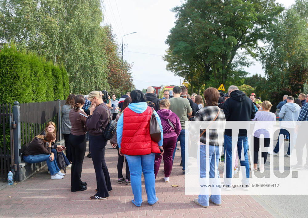 Stabbing attack at a primary school in Poland Photo: Wojciech Olkusnik East News People gather outside after a knife attack at the local primary school on October 8, 2026 in the village of Leszczydol-Nowiny in central Poland, approximately 60 km north-east of Warsaw. A 15-year-old school graduate entered the building armed with a knife and fatally stabbed the janitor and wounded two teachers trying to overpower him. According to the police the perpetrator was wearing a helmet with a camera and planned to record the attack. A day earlier a stabbing attack, where nine people were wounded, occurred in a vocational school in the town of Ostroleka, 50 km north of today s site. EN_01685559_0024
