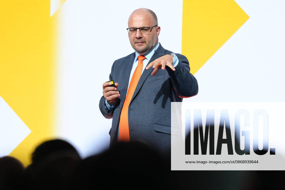 Brand Economy Day 2026: Author and speaker Stefan Kolev on stage during his keynote address at Brand Economy Day 2026, Berlin, October 8, 2026, Berlin, Berlin, Germany