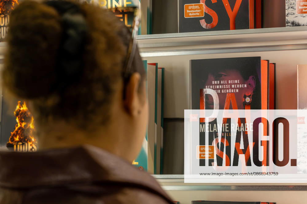 Frankfurt Book Fair 2026, August 10, 2026: A visitor looks at the books on display at a publisher’s booth at the Frankfurt Book Fair 2026. Books and visitors at the Fra