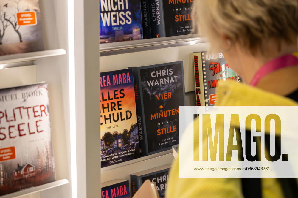 Frankfurt Book Fair 2026, August 10, 2026: A visitor looks at the books on display at a publisher’s booth at the Frankfurt Book Fair 2026. Books and visitors at the Fra
