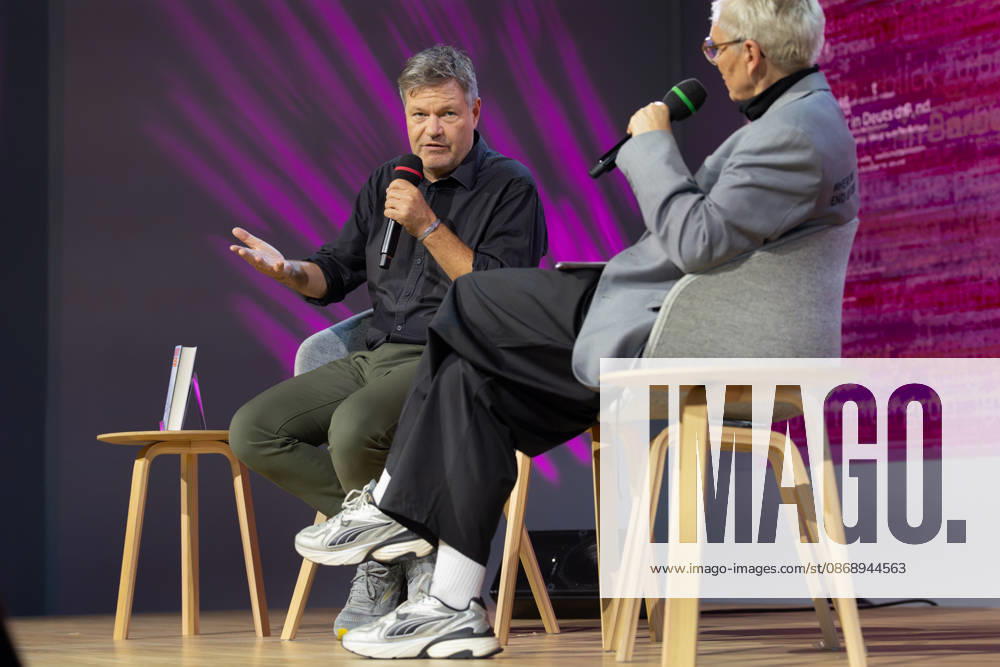 Frankfurt Book Fair 2026: Robert Habeck presents his new book, *Arctic Meltdown*, on the literature stage hosted by ARD, ZDF, and 3sat. In the foreground on the right is host Bärbel Schäfer. Frankfurt am Main, Hesse, Germany. Exhibition grounds.