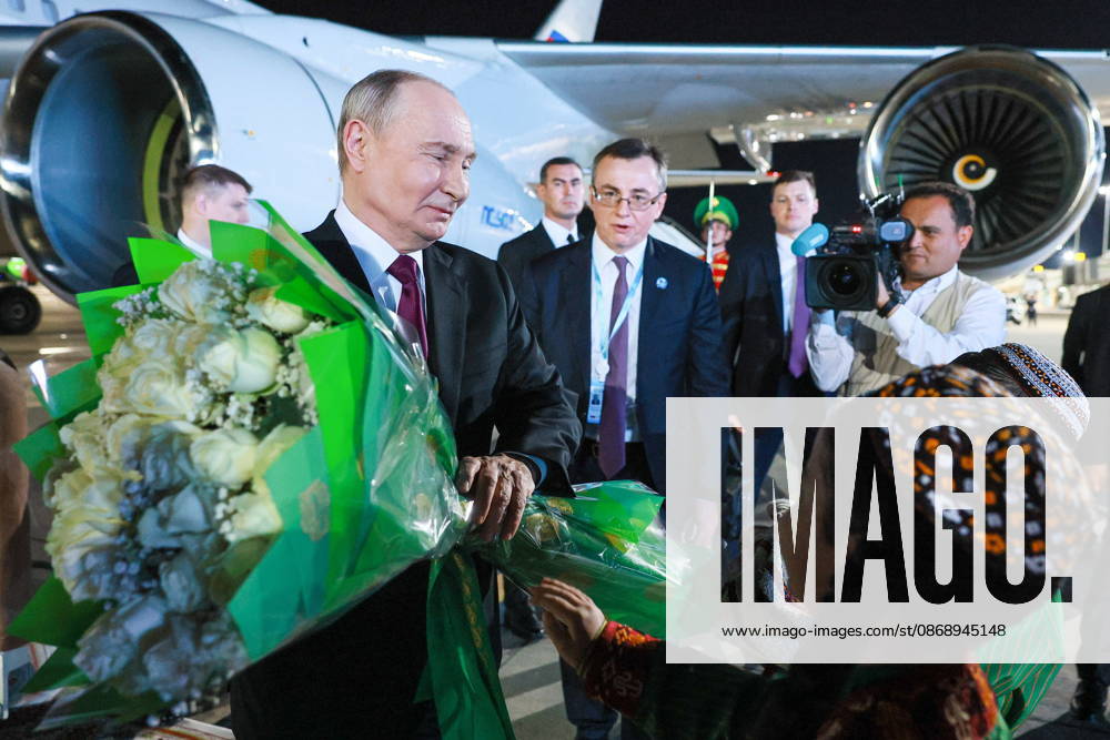 TURKMENISTAN, BALKAN PROVINCE - OCTOBER 8, 2026: Vladimir Putin, President of Russia, accepts flowers during a ceremony to welcome his arrival ahead of a meeting of the CIS (Commonwealth of Independent States) Council of Heads of State in Turkmenbasy Turkmenistan - ZUMAt113 20261008_zaa_t113_508