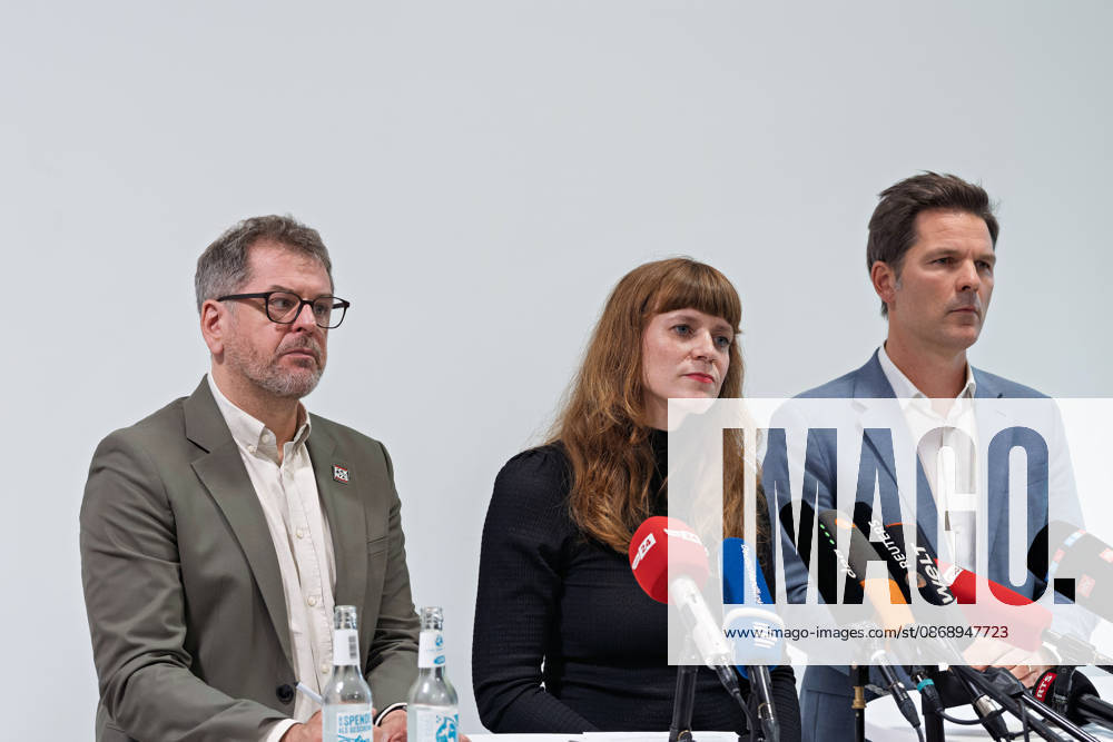 Werner Graf, Alliance 90 The Greens, left, Kerstin Wolter Ehling, The Left, M, and Steffen Krach (SPD, r) stand behind the media microphones during a joint press statement in the foyer of the Haus der Statistik following the conclusion of their parties’ preliminary talks. Press statement by The Left, the Greens, and the SPD in Berlin
