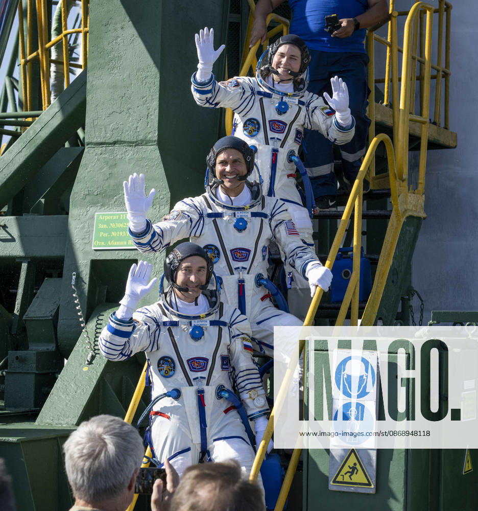 Baikonur, Kazakhstan. 14 July, 2026. Roscosmos cosmonaut Anna Kikina, top, NASA astronaut Anil Menon and Roscosmos cosmonaut Pyotr Dubrov wave farewell before boarding the Soyuz MS-29 spacecraft at the Baikonur Cosmodrome, July 14, 2026 in Baikonur, Kazakhstan. The trio launched to the International Space Station. Baikonur Kazakhstan - ZUMAp138 20261008_zaa_p138_013