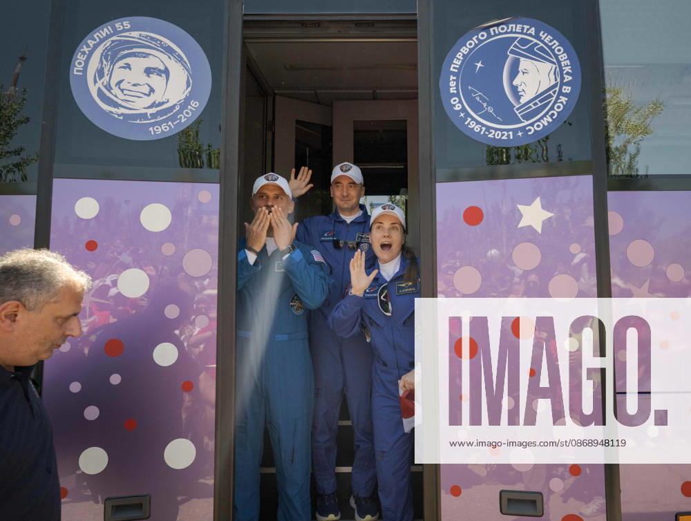 Baikonur, Kazakhstan. 14 July, 2026. NASA astronaut Anil Menon, left, and Roscosmos cosmonauts Pyotr Dubrov and Anna Kikina stand in the door of their bus as they depart the Cosmonaut Hotel for suit-up, July 14, 2026 in Baikonur, Kazakhstan. Kikina holds up a heart sign for well-wishers. Baikonur Kazakhstan - ZUMAp138 20261008_zaa_p138_015
