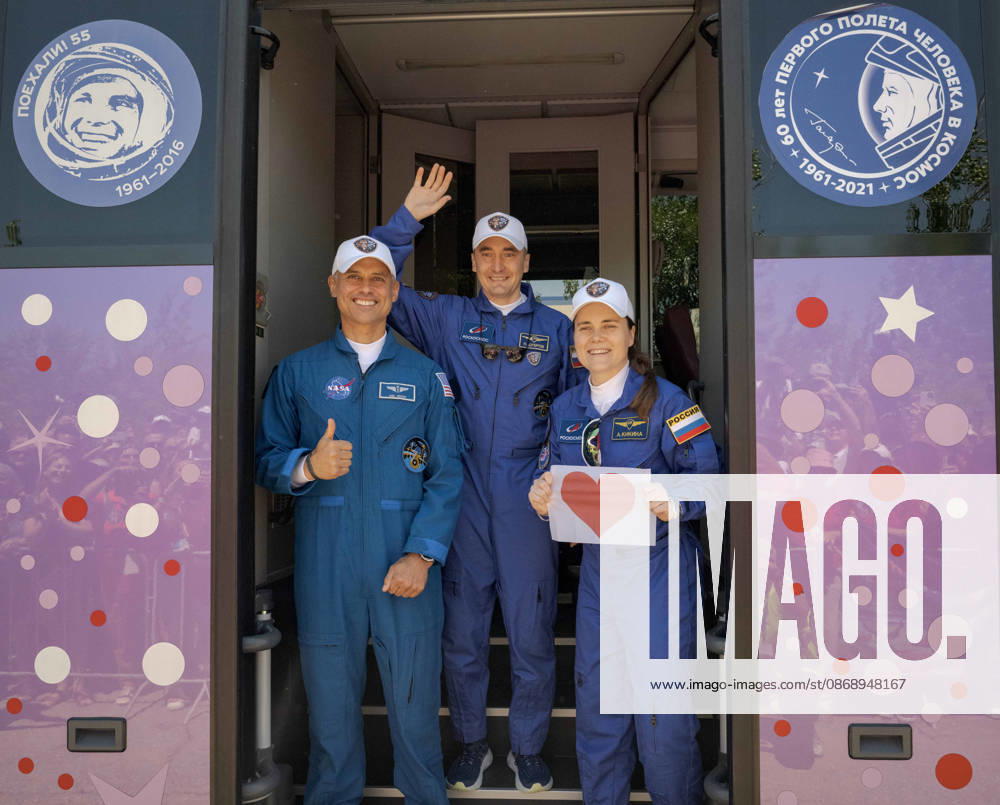 Baikonur, Kazakhstan. 14 July, 2026. NASA astronaut Anil Menon, left, and Roscosmos cosmonauts Pyotr Dubrov and Anna Kikina stand in the door of their bus as they depart the Cosmonaut Hotel for suit-up, July 14, 2026 in Baikonur, Kazakhstan. Kikina holds up a heart sign for well-wishers. Baikonur Kazakhstan - ZUMAp138 20261008_zaa_p138_016