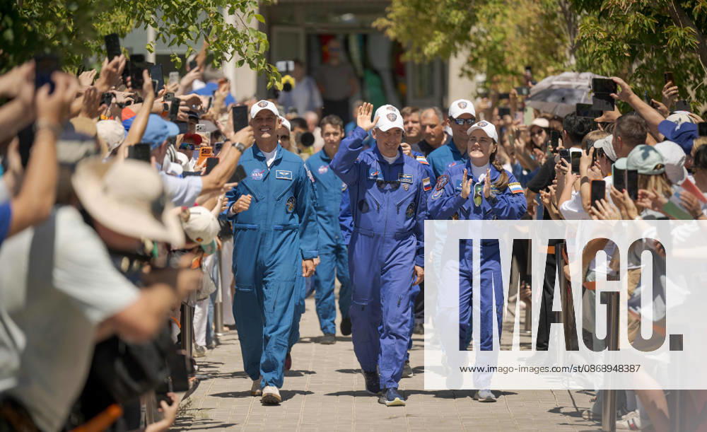 Baikonur, Kazakhstan. 14 July, 2026. NASA astronaut Anil Menon, left, and Roscosmos cosmonauts Pyotr Dubrov and Anna Kikina walk out of the Cosmonaut Hotel to suit up for their Soyuz launch, July 14, 2026 in Baikonur, Kazakhstan. The crew launched later that day to the International Space Station. Baikonur Kazakhstan - ZUMAp138 20261008_zaa_p138_023