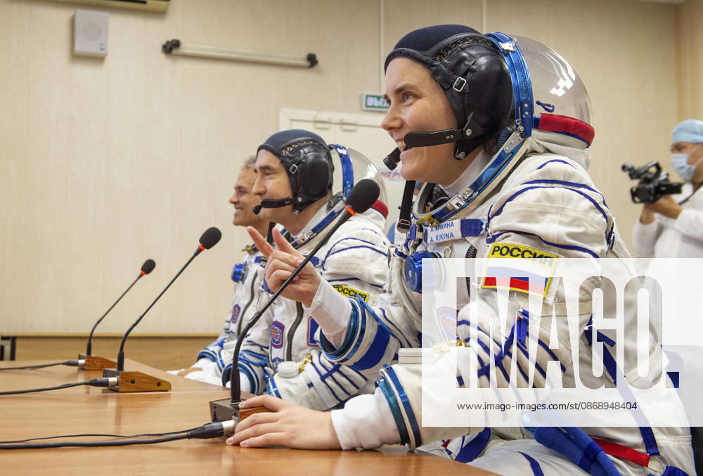 Baikonur, Kazakhstan. 14 July, 2026. Roscosmos cosmonaut Anna Kikina, foreground, Roscosmos cosmonaut Pyotr Dubrov and NASA astronaut Anil Menon, left, talk with family and friends after Sokol suit pressure checks at the Baikonur Cosmodrome, July 14, 2026 in Baikonur, Kazakhstan. The crew launched to the International Space Station later that day. Baikonur Kazakhstan - ZUMAp138 20261008_zaa_p138_025