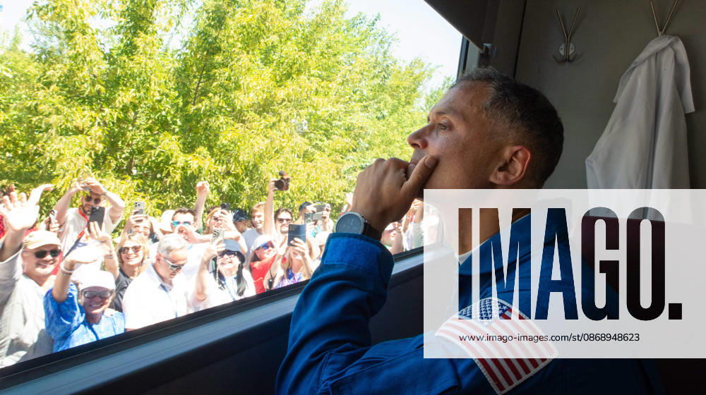 Baikonur, Kazakhstan. 14 July, 2026. NASA astronaut Anil Menon looks out the bus window as he departs the Cosmonaut Hotel with crewmates Anna Kikina and Pyotr Dubrov for suit-up, July 14, 2026 in Baikonur, Kazakhstan. The crew launched later that day to the International Space Station. Baikonur Kazakhstan - ZUMAp138 20261008_zaa_p138_037