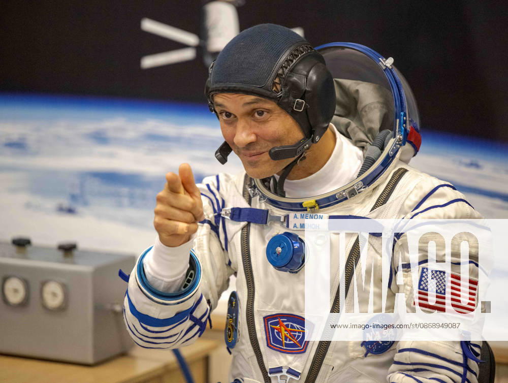 Baikonur, Kazakhstan. 14 July, 2026. NASA astronaut Anil Menon gestures to family and friends while waiting for his Sokol suit pressure check at the Baikonur Cosmodrome, July 14, 2026 in Baikonur, Kazakhstan. He launched to the International Space Station later that day. Baikonur Kazakhstan - ZUMAp138 20261008_zaa_p138_054