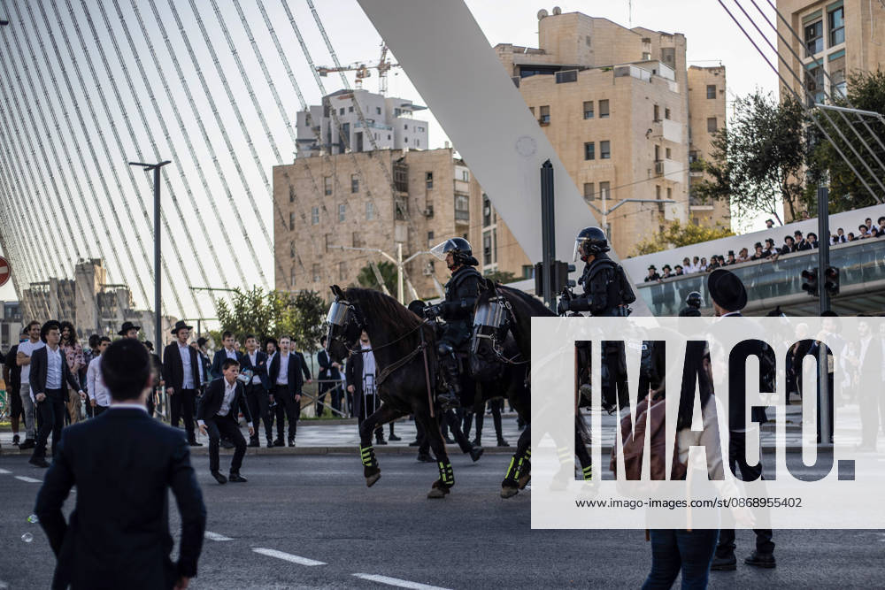 Anti-military service Ultra-Orthodox Jews block road to West Jerusalem JERUSALEM - OCTOBER 8: Mounted Israeli police officers on horseback deployed to the scene intervene against demonstrators as Ultra-Orthodox Jews, known as Haredi, protest the lack of legislation exempting yeshiva students from mandatory military service and the detention of students on grounds of draft evasion in West Jerusalem, Israel, on October 8, 2026. Haredi protesters lie on the road leading to West Jerusalem and block traffic. Mostafa Alkharouf Anadolu Jerusalem Israel. Editorial use only. Please get in touch for any other usage.