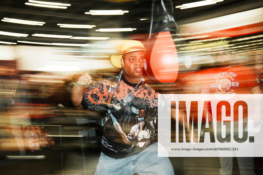 An attendee swings at a punching bag at the 2026 New York Comic Con at the Javits Center on October 8, 2026 in New York. New York USA - ZUMAb148 20261008_zap_b148_061
