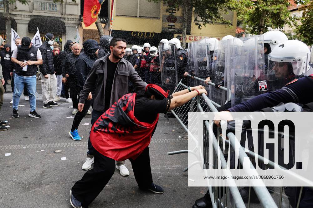 TIRANA, ALBANIA Ã¢â‚¬ OCTOBER 8, 2026: Citizens, local activists and supporters of the opposition gather outside the Albanian Parliament as lawmakers debate and vote on proposed changes to the countryÃ¢â‚¬â ¢s administrative-territorial division. The reform proposes reducing the number of municipalities from 61 to 46 through the merger of 15 existing municipalities, including DivjakoÂ«, PolioÂßan and Memaliaj. Residents and representatives of municipalities affected by the proposed changes joined the protest, calling for their municipalities to be preserved. Protesters displayed banners and slogans opposing the proposed mergers. Tensions escalated between protesters and police, with reports of eggs and - ZUMAq101 20261008_zna_q101_063