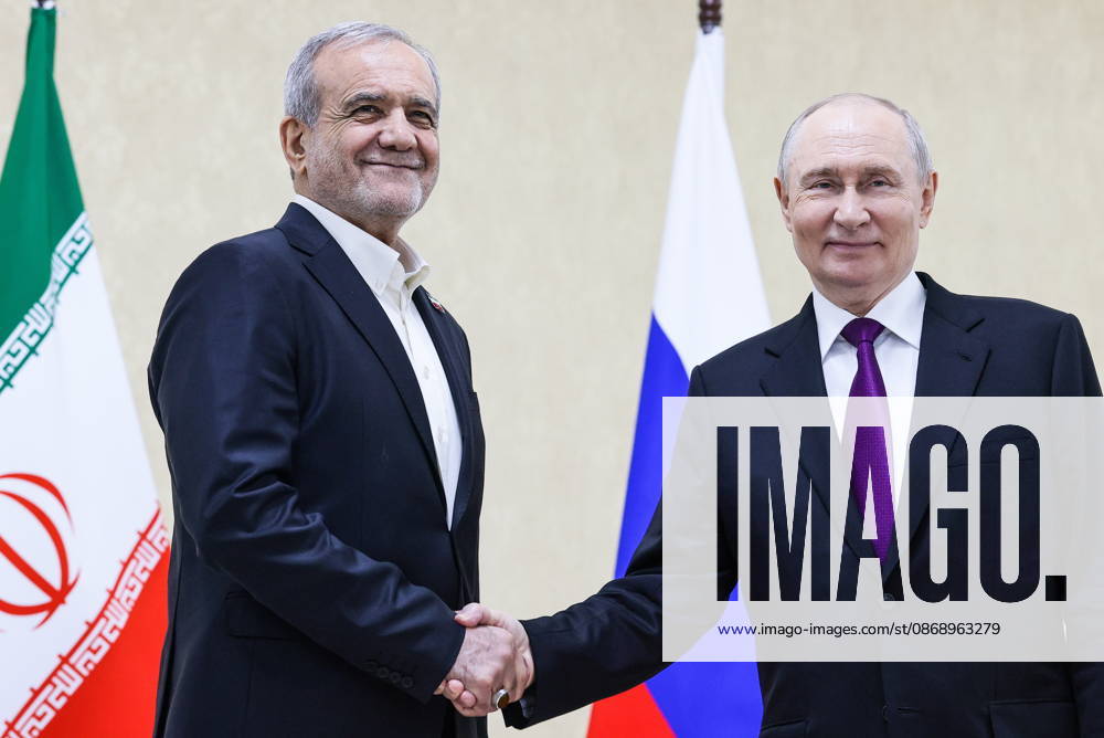 TURKMENISTAN, BALKAN PROVINCE - OCTOBER 8, 2026: Masoud Pezeshkian (L), President of Iran, and his counterpart Vladimir Putin of Russia shake hands during a bilateral meeting in Turkmenbasy Turkmenistan - ZUMAt113 20261008_zaa_t113_734