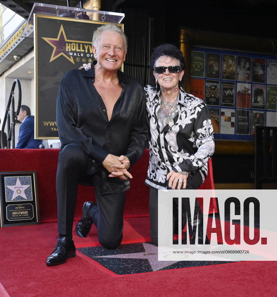 Graham Russell (L) and Russell Hitchcock of the rock duo Air Supply kneel next to their star during an unveiling ceremony honoring them with the 2,859th star on the Hollywood Walk of Fame in Los Angeles on Thursday October 8, 2026. LAP2026100809 JIMxRUYMEN