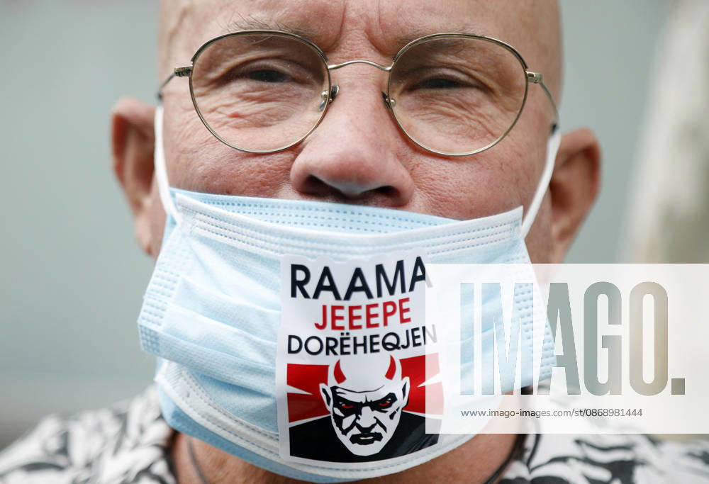 Demonstration Against the Proposed Territorial Reform in Tirana, Albania. A man wears a protective mask reading Rama, give your resignation during an anti-government protest against the government s administrative and territorial reform, in front of the Parliament building in Tirana, Albania, on October 8, 2026. Light Studio Agency Malton Dibra Tirana Albania