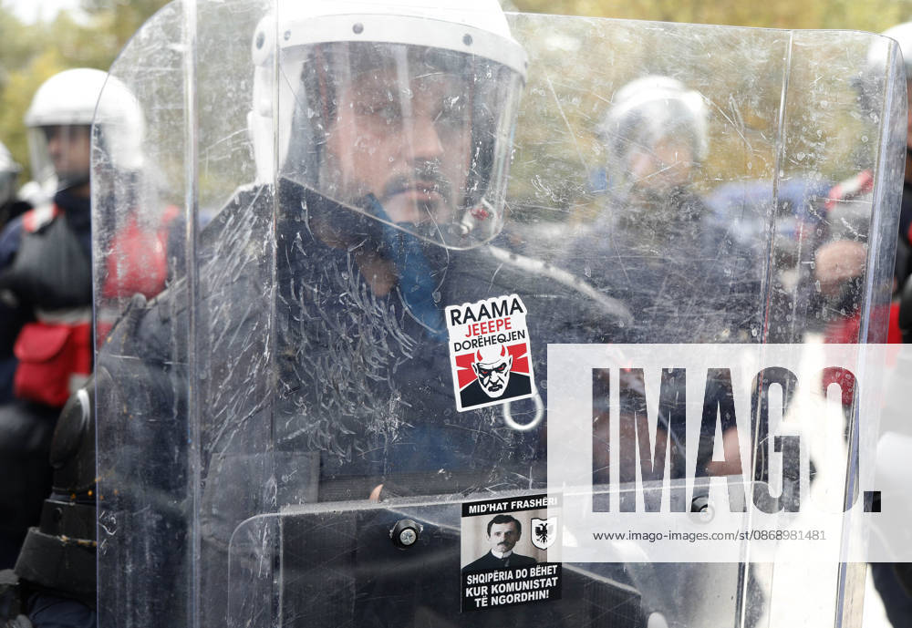 Demonstration Against the Proposed Territorial Reform in Tirana, Albania. A riot police officer stands behind a protective visor with a sticker reading Rama, give your resignation during an anti-government protest against the government s administrative and territorial reform, in front of the Parliament building in Tirana, Albania, on October 8, 2026. Light Studio Agency Malton Dibra Tirana Albania