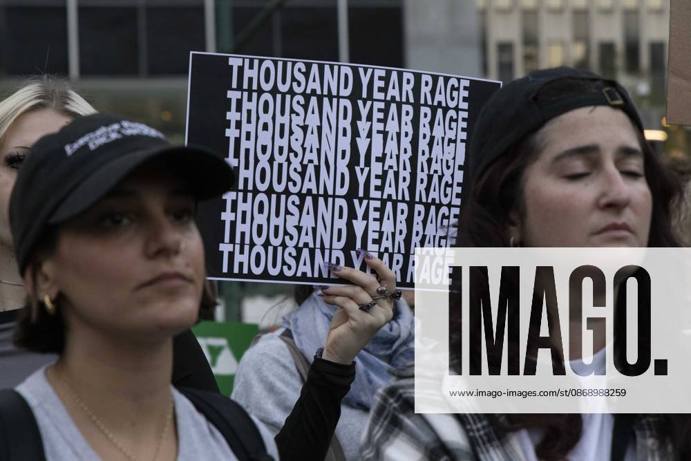 A demonstrator holds a sign that reads THOUSAND YEAR RAGE joining hundreds at a rally in Foley Square outside the New York State Supreme Court building in Lower Manhattan under the banner . StopSexualViolence: From the Frat House to the White House. The protest is one of many rallies and campus walkouts around the country demanding justice for Cornell s Jane Doe. New York USA - ZUMAr174 20261008_znp_r174_014