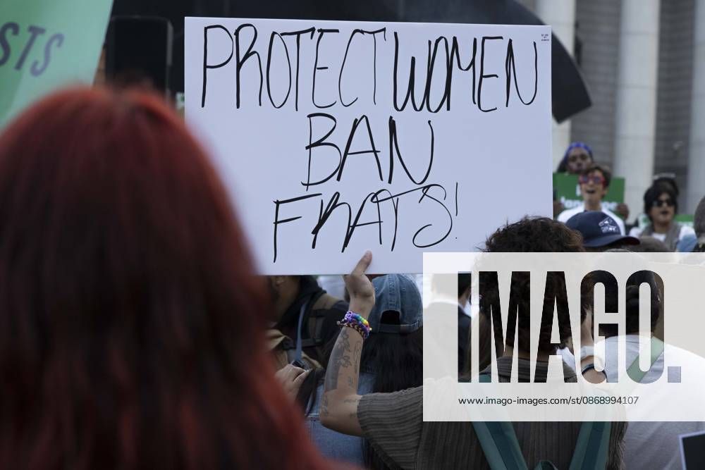 A demonstrator holds a sign that reads PROTECT WOMEN BAN FRATS! joining hundreds at a rally in Foley Square outside the New York State Supreme Court building in Lower Manhattan under the banner . StopSexualViolence: From the Frat House to the White House. The protest is one of many rallies and campus walkouts around the country demanding justice for Cornell s Jane Doe. New York USA - ZUMAr174 20261008_znp_r174_026