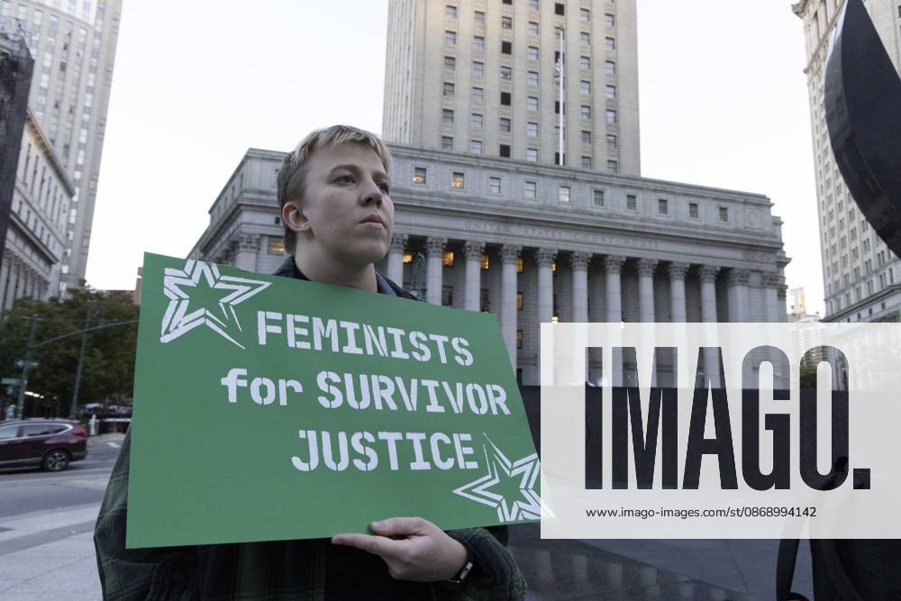 A demonstrator holds a sign that reads FEMINISTS FOR SURVIVOR JUSTICE joining hundreds at a rally in Foley Square outside the New York State Supreme Court building in Lower Manhattan under the banner . StopSexualViolence: From the Frat House to the White House. The protest is one of many rallies and campus walkouts around the country demanding justice for Cornell s Jane Doe. New York USA - ZUMAr174 20261008_znp_r174_029