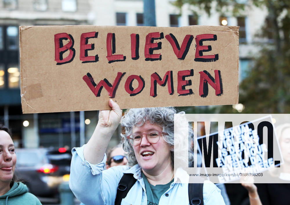 A woman holds a sign that says, Believe Women . A demonstration of several hundred people, mostly women, showed support for Cornell student Jane Doe , who sued after a 2024 gang rape. The protestors gathered at Foley Square and called for tougher action against sexual violence. New York City USA - ZUMAk45_ 20261008_zaf_k45_014