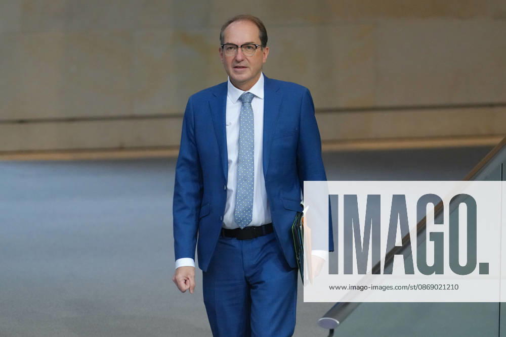 German Bundestag, 100th Plenary Session: Alexander Dobrindt, Federal Minister of the Interior, walks through the chamber toward the government bench with animated facial expressions during the 100th session of the German Bundestag in Berlin, October 9, 2026, Berlin, Berlin, Germany