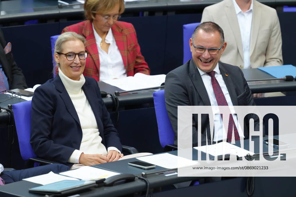 German Bundestag, 100th Plenary Session: AfD leaders Alice Weidel and Tino Chrupalla are having fun together in their seats in the plenary chamber during the 100th session of the German Bundestag in Berlin, October 9, 2026, Berlin, Germany