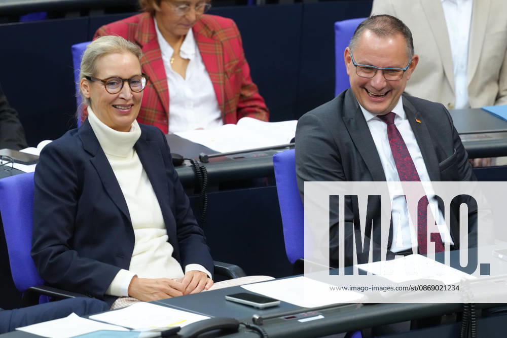 German Bundestag, 100th Plenary Session: AfD leaders Alice Weidel and Tino Chrupalla are having fun together in their seats in the plenary chamber during the 100th session of the German Bundestag in Berlin, October 9, 2026, Berlin, Germany