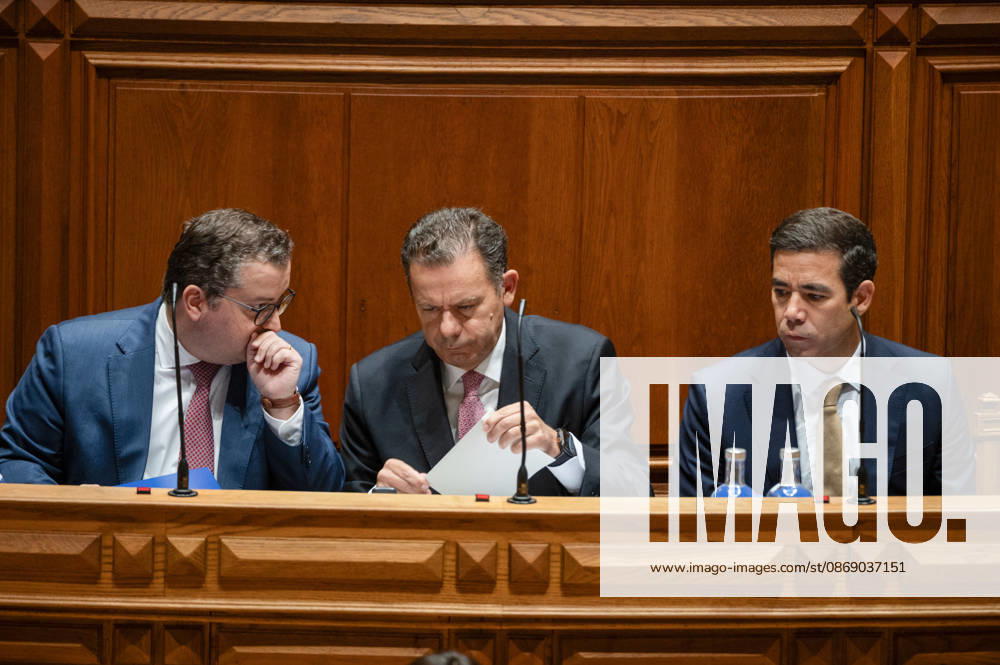 Portuguese Prime Minister LUIS MONTENEGRO, center, looks over documents on the government bench during the fortnightly parliamentary debate at the Assembleia da Republica in Lisbon, Portugal, on October 9, 2026. The government-accountability session was scheduled to be followed by a debate preparing Portugal s position for the European Council. Lisbon Portugal - ZUMAr238 20261009_zip_r238_002