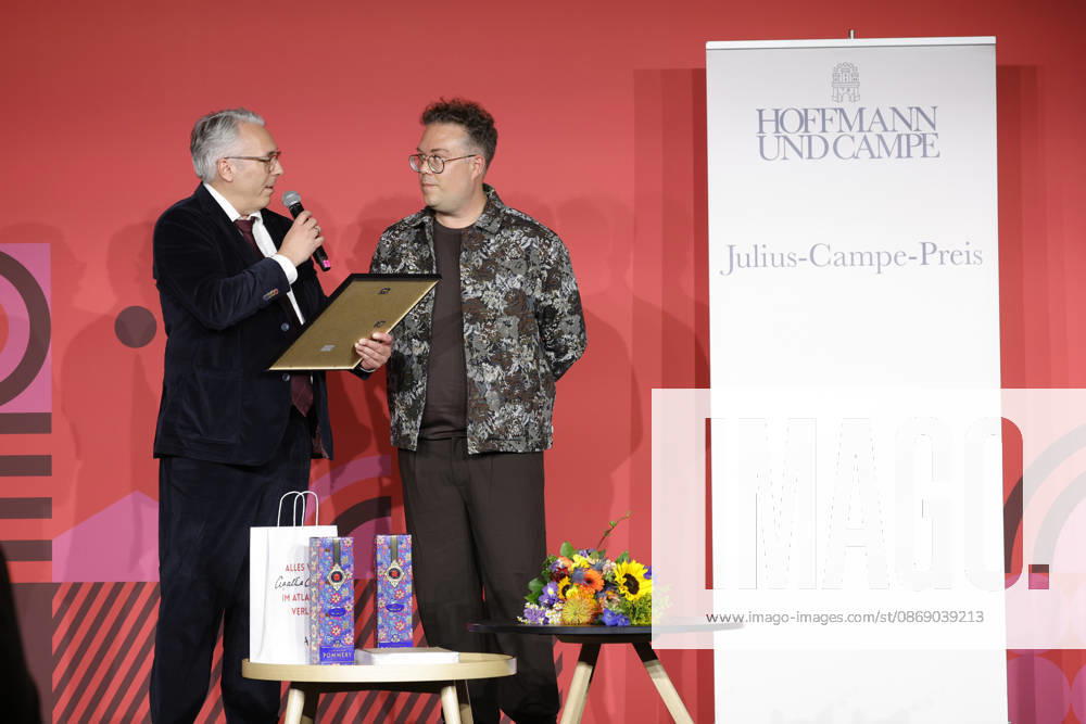 Frankfurt Impressions 09 10 2026 At the 78th Frankfurt Book Fair in 2026, the Julius Campe Prize—99 bottles of wine—will be awarded to Thomas Sachsenmeier (wearing a brown shirt, on the left). Tim Jung, publishing director at Hoffmann und Campe, Frankfurt am Main, Hesse, Germany