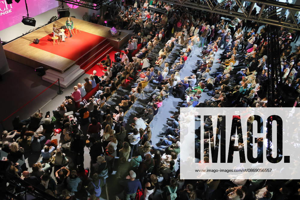 Frankfurt am Main, Germany, Frankfurt Book Fair: Caroline Wahl, author of the book *1,999 Meters Above Sea Level*, in conversation on the ARD Stage; a crowd of visitors gathers around Caroline Wahl