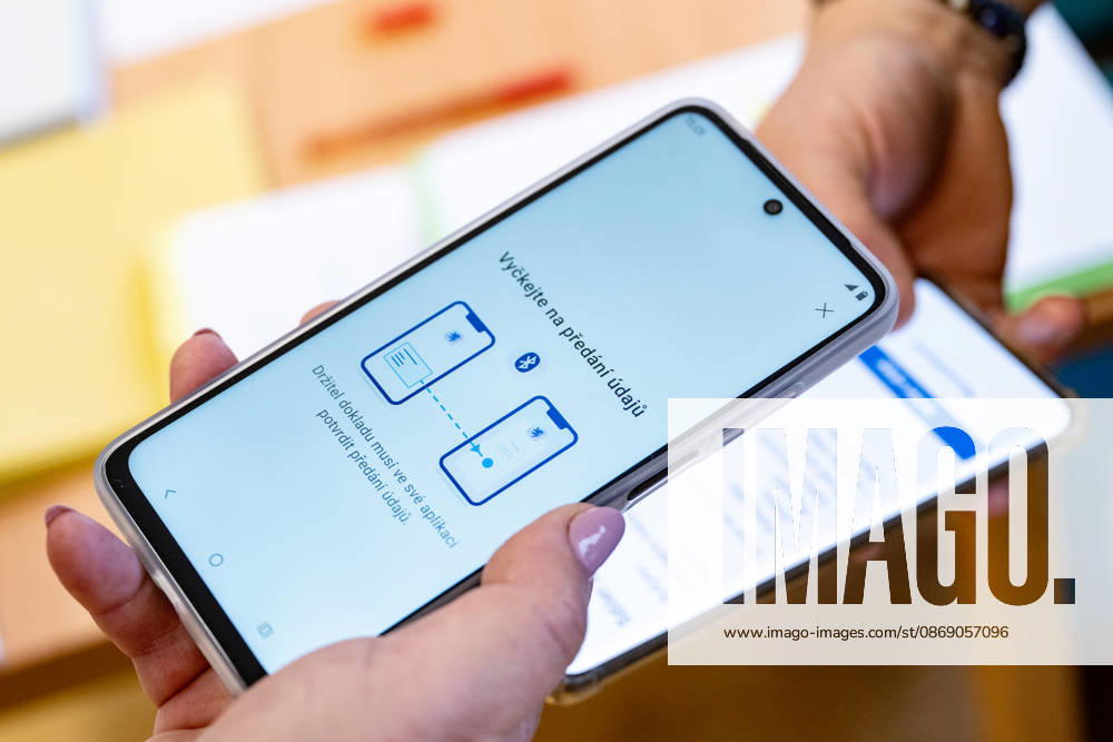 The two-day elections to municipal assemblies started in the Czech Republic together with the first round of the elections to one-third of the Senate, on October 9, 2026. On the photo a voter identifies himself at a polling station using the eDoklady app (digital ID copy) on his mobile phone before casting his vote in Hradec Kralove. (CTKxPhoto DavidxTanecek) CTKPhotoP2026100905576 CTKPhotoP2026100905576