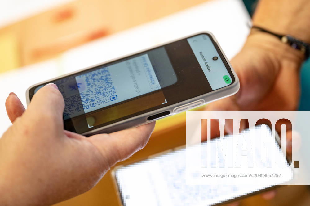 The two-day elections to municipal assemblies started in the Czech Republic together with the first round of the elections to one-third of the Senate, on October 9, 2026. On the photo a voter identifies himself at a polling station using the eDoklady app (digital ID copy) on his mobile phone before casting his vote in Hradec Kralove. (CTKxPhoto DavidxTanecek) CTKPhotoP2026100905645 CTKPhotoP2026100905645