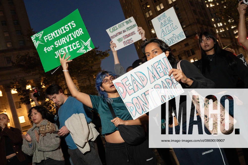 A woman hides her face behind a sign that reads dead men dont rape New York United States - ZUMAf193 20261008_znp_f193_017