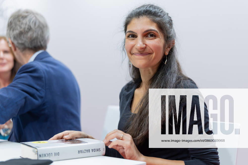 Frankfurt Book Fair 2026: Shida Bazyar, winner of the 2026 German Book Prize. In front of her is the award-winning book *Die Lücken*, Frankfurt am Main, Hesse, Germany, Exhibition Center