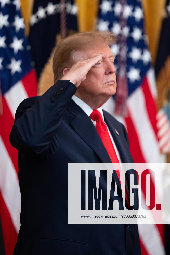President Donald Trump salutes during the National Anthem during an event in the East Room of the White House in Washington, DC on Friday, Oct. 9, 2026. Trump is hosting a Columbus Day celebration. WASP20261009112 AaronxSchwartz