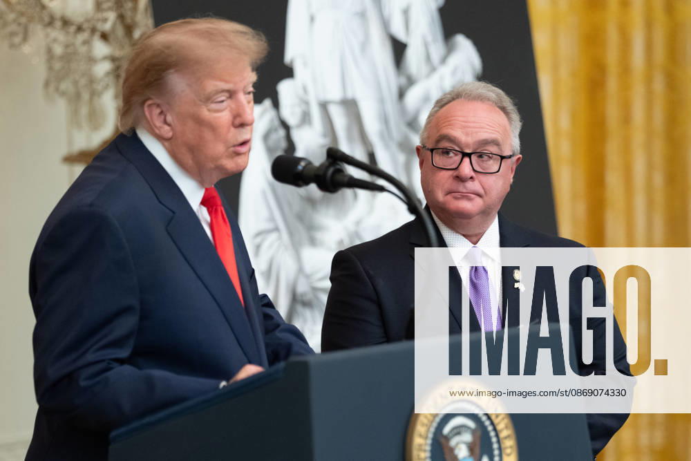 Brett Rugo, founder of Rugo Stone which constructed a helipad on the South Lawn, looks on as President Donald Trump speaks during an event in the East Room of the White House in Washington, DC on Friday, Oct. 9, 2026. Trump is hosting a Columbus Day celebration. WASP20261009116 AaronxSchwartz