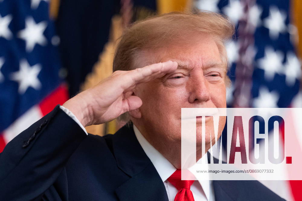 President Donald Trump salutes during the National Anthem during an event in the East Room of the White House in Washington, DC on Friday, Oct. 9, 2026. Trump is hosting a Columbus Day celebration. WASP20261009131 AaronxSchwartz
