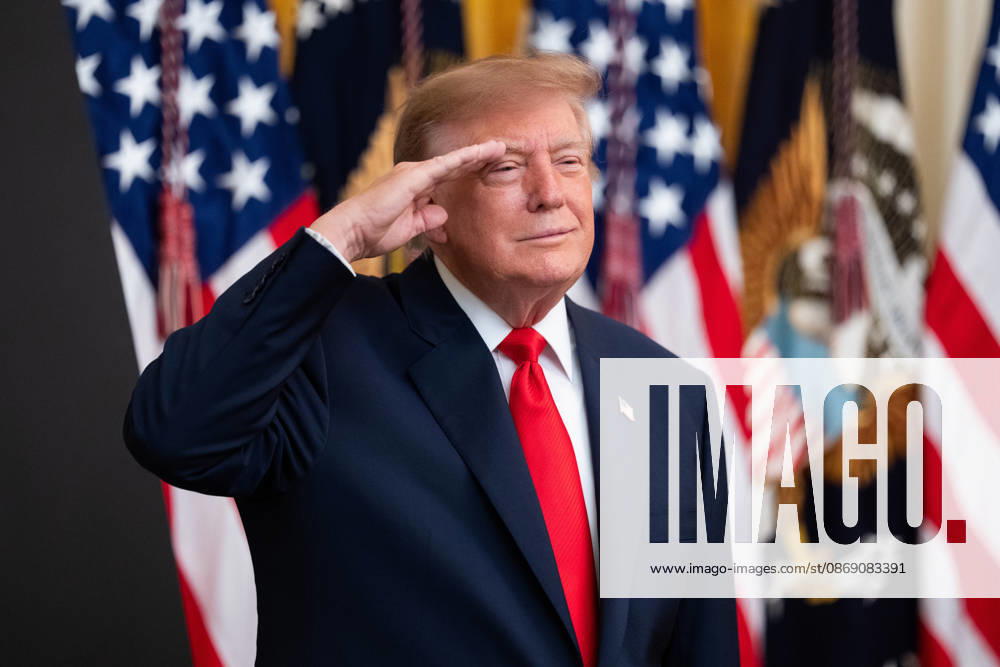 United States President Donald J Trump salutes during the national anthem as he hosts a Columbus Day Celebration in the East Room of the White House in Washington, DC, USA on Friday, October 8, 2026 Washington USA - ZUMAs152 20261009_faa_s152_033