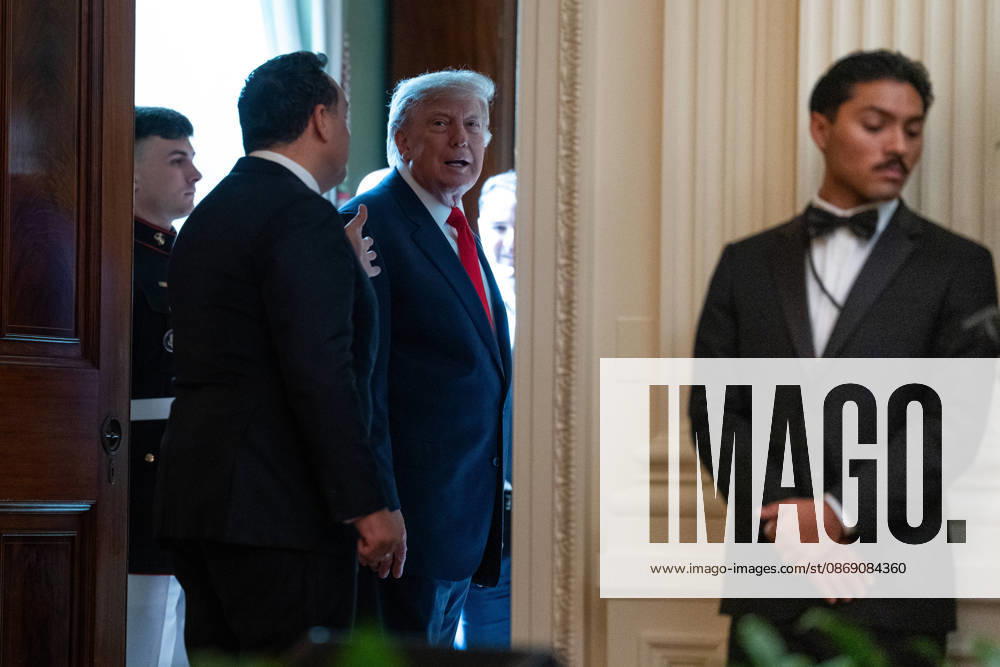 United States President Donald J Trump and singer Christopher Macchio depart a Columbus Day Celebration in the East Room of the White House in Washington, DC, USA on Friday, October 8, 2026 Washington USA - ZUMAs152 20261009_faa_s152_058