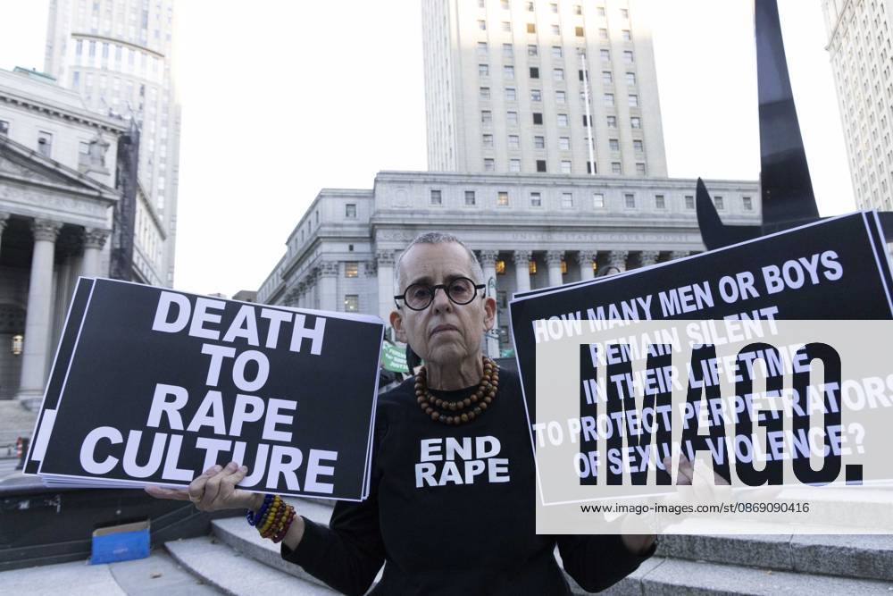 A demonstrator wears a shirt that reads END RAPE and holds signs that read DEATH TO RAPE CULTURE HOW MANY MEN OR BOYS REMAIN SILENT IN THEIR LIFETIME TO PROTECT PERPETRATORS OF SEXUAL VIOLENCE? joining hundreds at a rally in Foley Square outside the New York State Supreme Court building in Lower Manhattan under the banner . StopSexualViolence: From the Frat House to the White House. The protest is one of many rallies and campus walkouts around the country demanding justice for Cornell s Jane Doe. New York USA - ZUMAr174 20261008_znp_r174_055