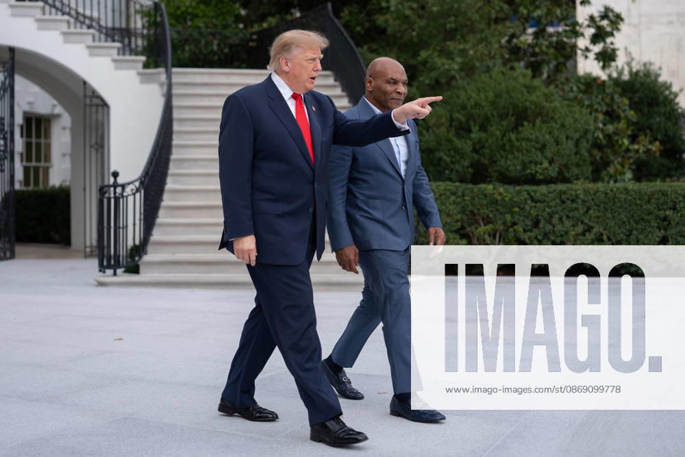 President Donald Trump walks with former professional boxer Mike Tyson on the South Lawn of the White House before boarding Marine One in Washington, DC on Friday, Oct. 9, 2026. Trump is heading to Syracuse on Friday to boost Republican gubernatorial candidate Bruce Blakeman, who is trailing Governor Kathy Hochul in polls ahead of November s election. WASP20261009143 AaronxSchwartz