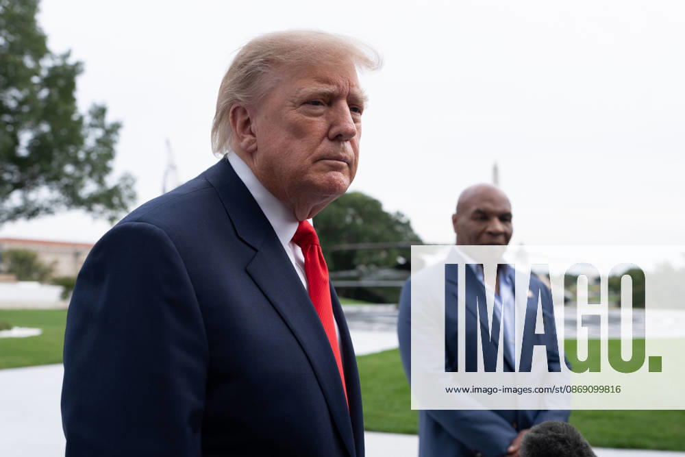 President Donald Trump stands with former professional boxer Mike Tyson while speaking to members of the media on the South Lawn of the White House before boarding Marine One in Washington, DC on Friday, Oct. 9, 2026. Trump is heading to Syracuse on Friday to boost Republican gubernatorial candidate Bruce Blakeman, who is trailing Governor Kathy Hochul in polls ahead of November s election. WASP20261009150 AaronxSchwartz