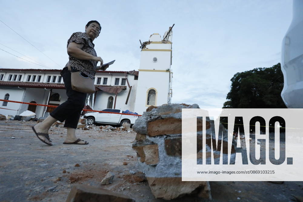(261010) -- PANAMA CITY, Oct. 10, 2026 -- A woman walks near a collapsed bell tower of a church after a strong earthquake in Penonome, central Cocle Province of Panama. A powerful earthquake and a series of strong aftershocks rattled Panama on Friday, sending residents into the streets, disrupting water supplies and briefly halting flights as the government mobilized emergency personnel and resources. The University of Panama s Institute of Geosciences measured the initial quake at magnitude 7.2. It struck at 12:56 p.m. local time (1756 GMT) at a depth of 4 kilometers. By 5:30 p.m. local time, more than 40 earthquakes had been recorded, including over a dozen with magnitudes above 5.0. A quake at 3:25 p.m. had a magnitude of 6.9. (Photo