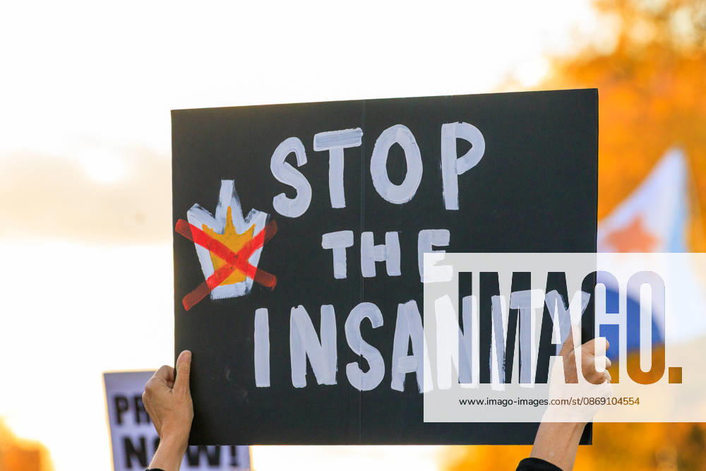 A stop the insanity sign at the protest held in Clinton Square in Syracuse, NY. Syracuse USA - ZUMAh195 20261009_znp_h195_013