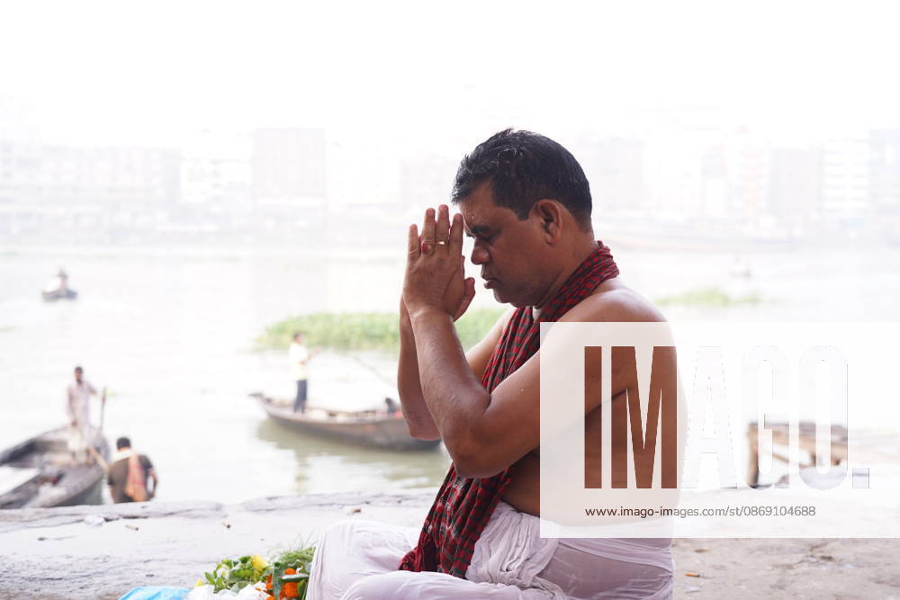 DHAKA, Bangladesh, October 10, 2026 Ã¢â‚¬ Hindu devotees gather on the banks of the Buriganga River at Wiseghat early on Mahalaya to perform Tarpan, a ritual offering of water in remembrance of deceased ancestors, marking the end of Pitru Paksha and the beginning of Debipaksha, which heralds the arrival of the Hindu goddess Durga...According to Hindu beliefs, the ritual expresses reverence and gratitude toward departed ancestors and seeks peace for their souls. Observed on the new moon day of Mahalaya, Tarpan is a longstanding tradition in which devotees remember ancestors from both paternal and maternal lineages...Mahalaya marks the transition from Pitru Paksha, a period dedicated to rememberi - ZUMAk185 20261010_zip_k185_001