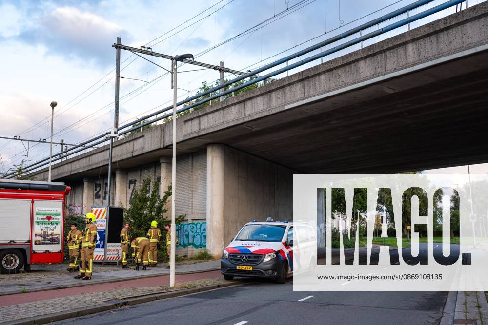 ROTTERDAM - Firefighters at a railway bridge in Delfshaven. Due to arson, no trains are running between Rotterdam Centraal and Delft Campus stations. MEDIATV ANP netherlands out - belgium out