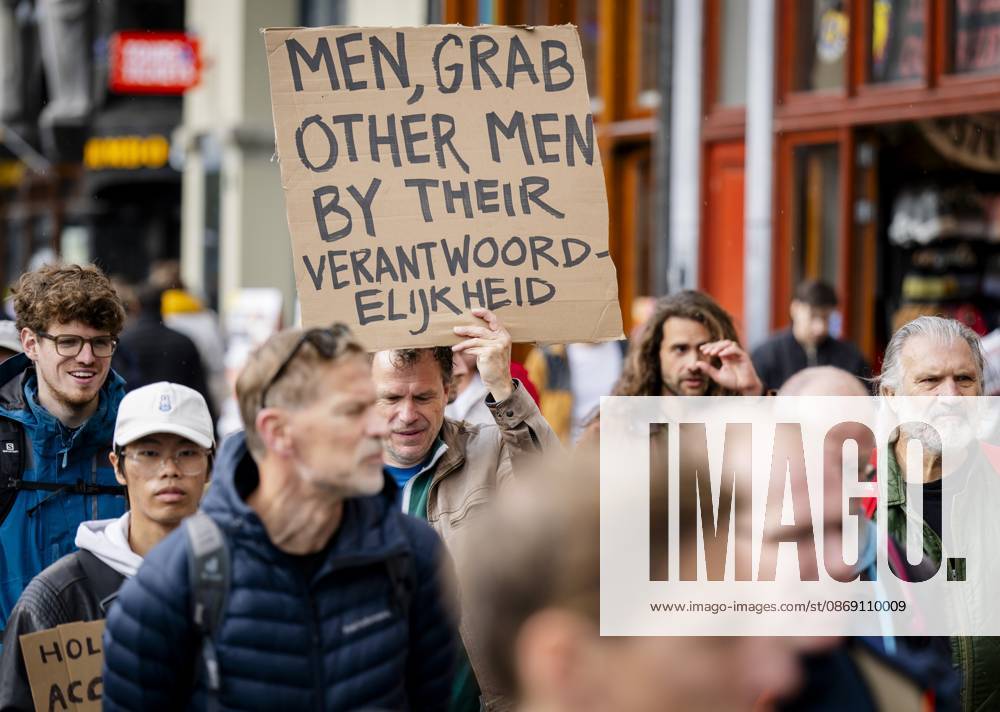 AMSTERDAM - Participants in the Men s March are campaigning for safety for all women. During the demonstration, men are called upon to ensure a culture in which everyone is safe. SEM VAN DER WAL ANP netherlands out - belgium out