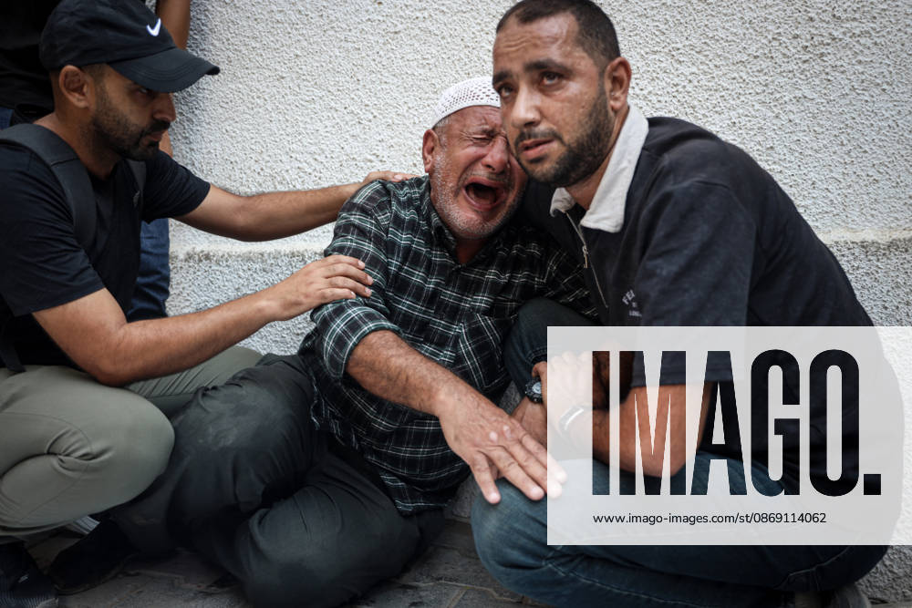 Israeli army continues attacks on Gaza despite ceasefire GAZA CITY, GAZA, PALESTINE - OCTOBER 10: Palestinians mourn after losing their loved ones in an Israeli attack on Gaza City, as Israeli army continues its attacks on the Gaza Strip despite the ceasefire, in Gaza City, Palestine, on October 10, 2026. The bodies of those killed in the attack were brought to Al-Shifa Hospital. Abdalhkem Abu Riash Anadolu Gaza City Gaza. Editorial use only. Please get in touch for any other usage.